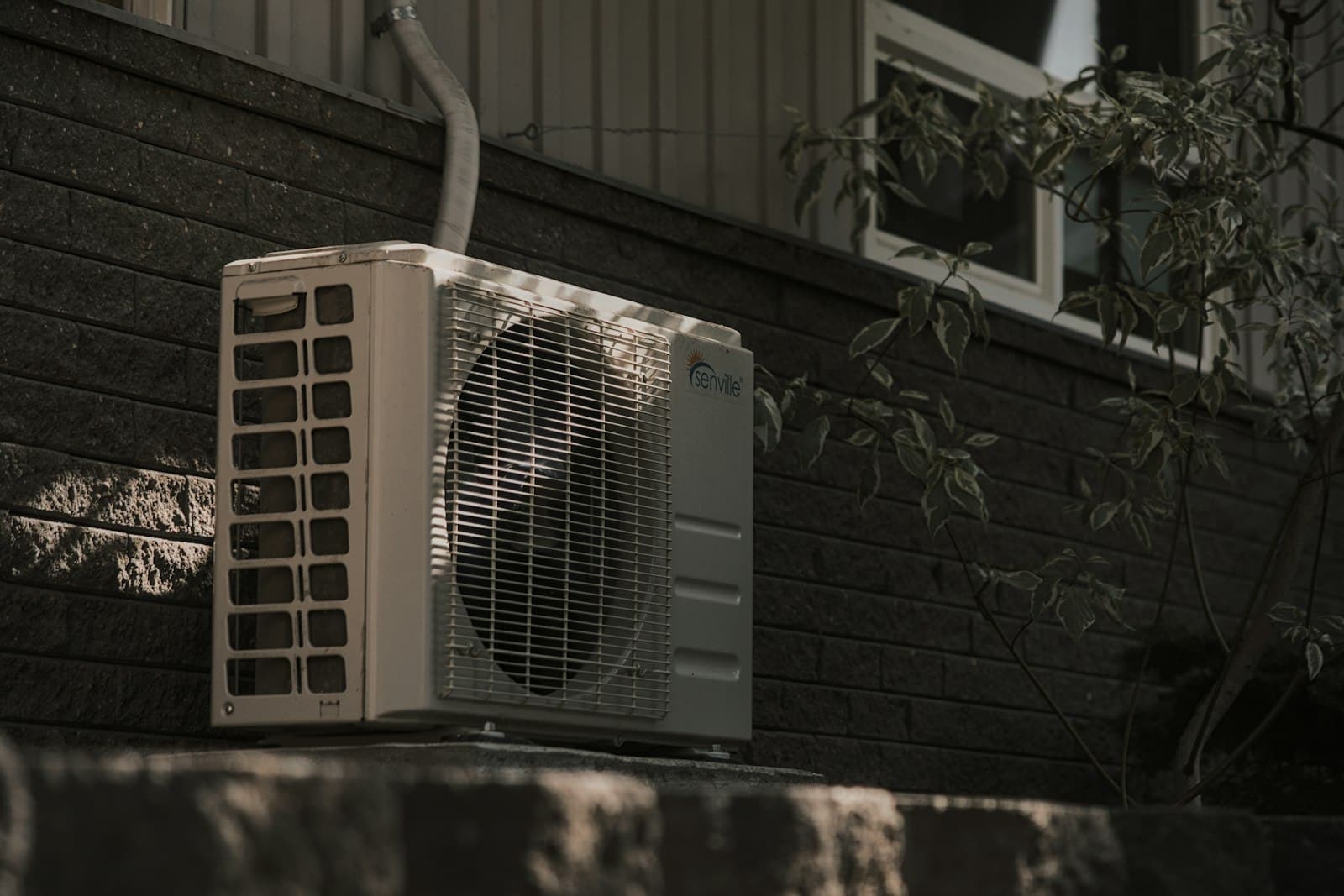 Installed HVAC condenser unit — R134a / R32 / R410a refrigerants are the heart of the system