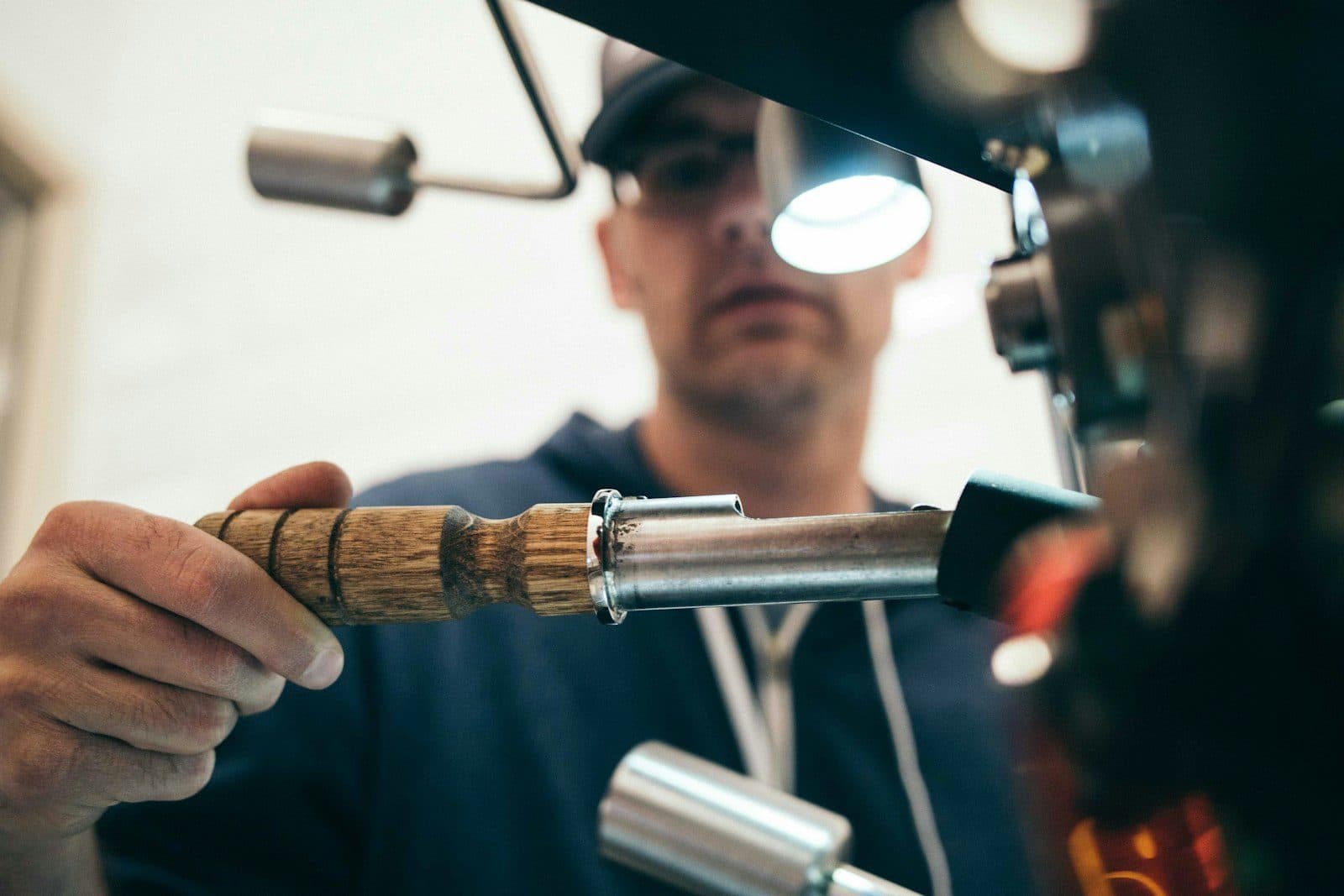 Industrial hydraulic pump and high-pressure pipes in a factory setting