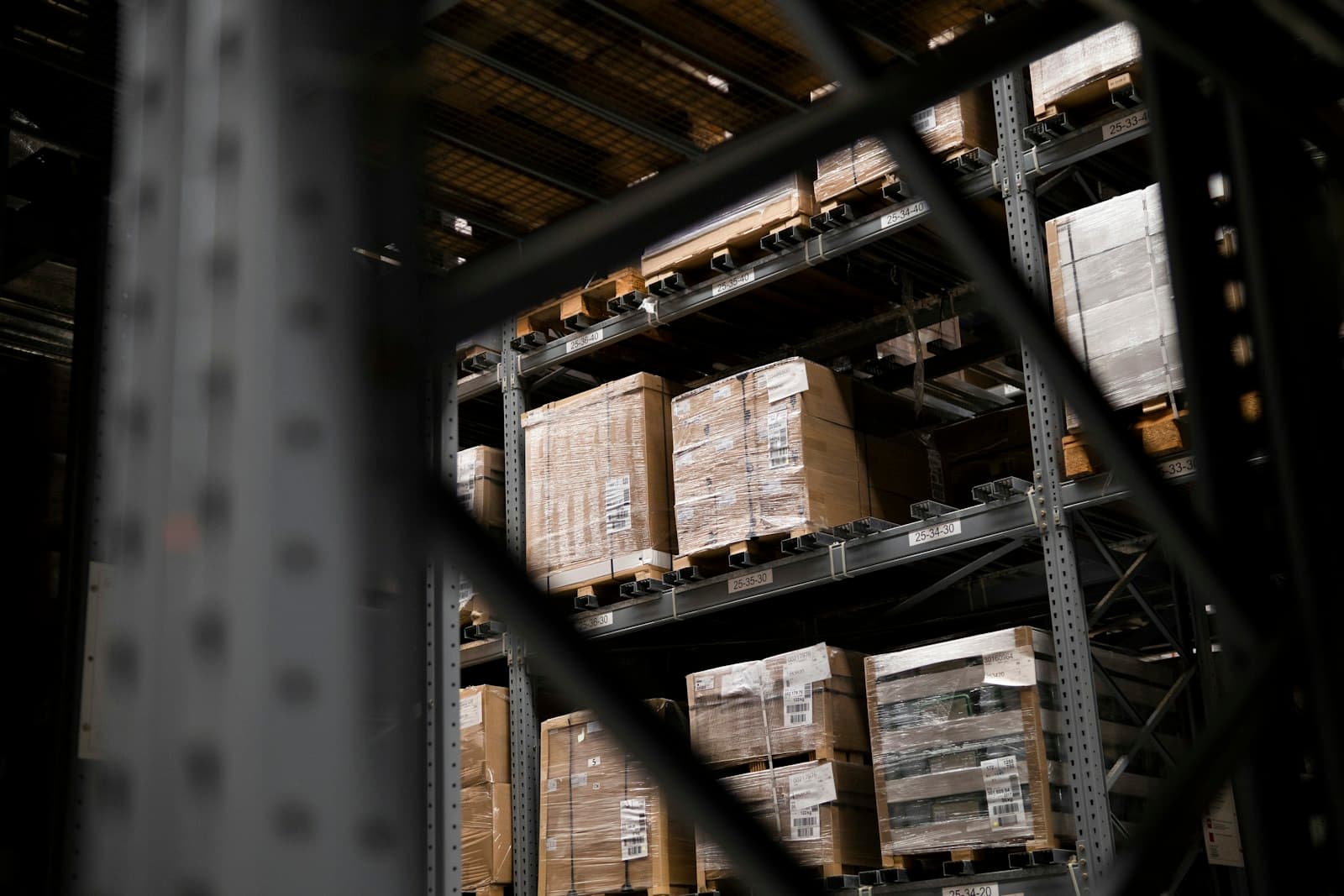 Safety inspector checking warehouse pallet racking system